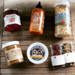 Local gift box includes local jam, hot sauce, popcorn, mustard, cheese and chocolates