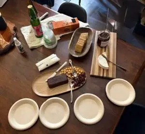 Selection of specialty chocolates, local cheese, crackers, jam and beverages