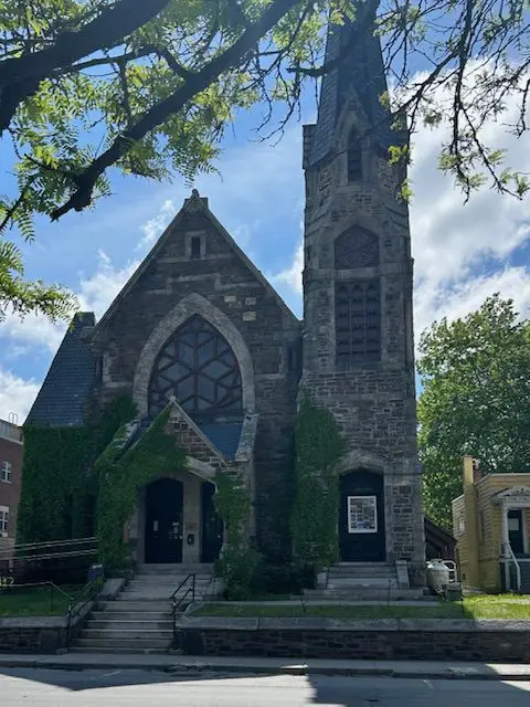 The Stone Church music venue with stained glass and steeple