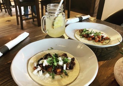 Two fresh authentic tacos with pork margarita with fresh lime